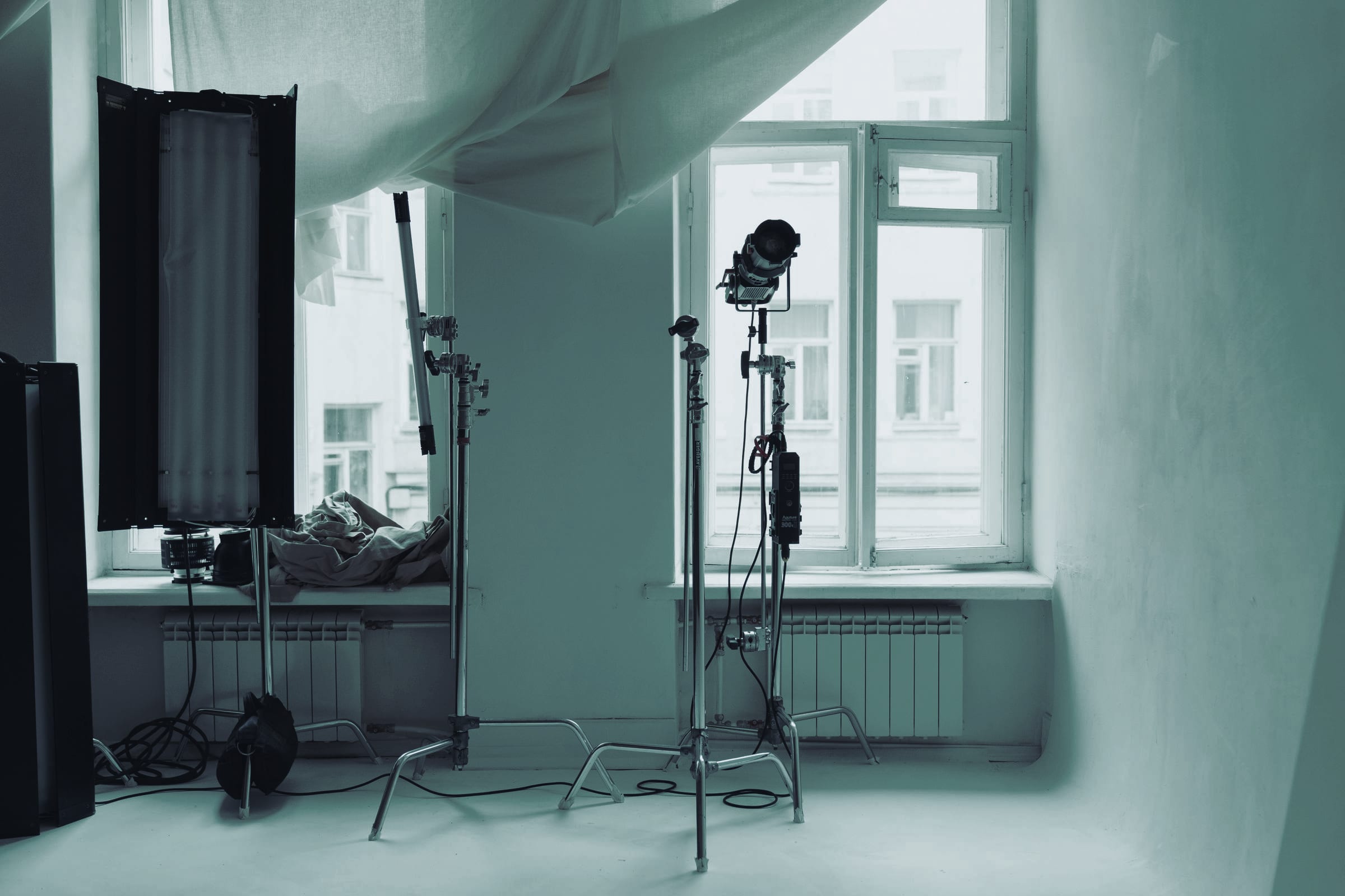 A daylight studio with lighting stands, no people.